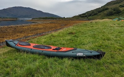 Green Neris Smart PRO S with an orange spraydeck and rear loading hatch